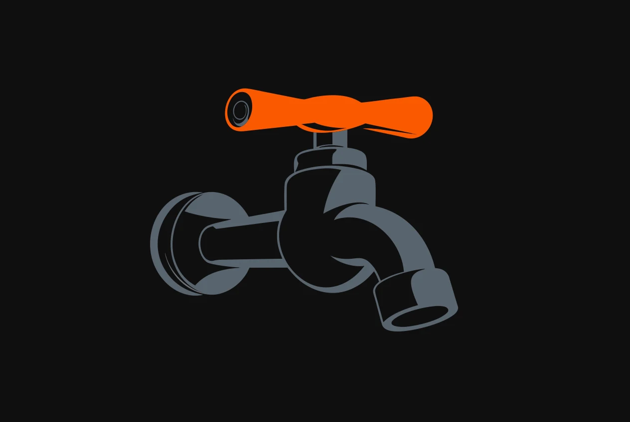 A wall tap on a stub of pipe that ends abruptly behind it, the tap handle coloured orange.